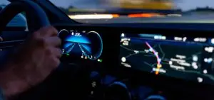 driving a car with the electronic dashboard visible