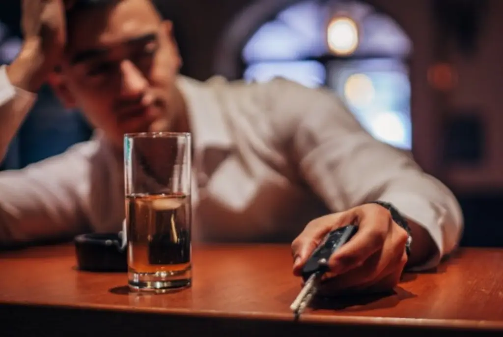 drinking at a bar holding car keys