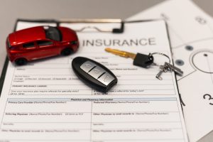 Car insurance form with car key